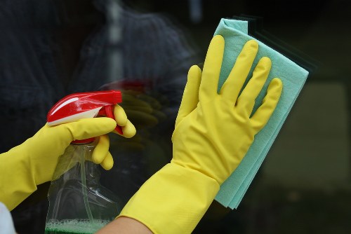 Carpet cleaner preparing safety equipment before a cleaning job in Cr0