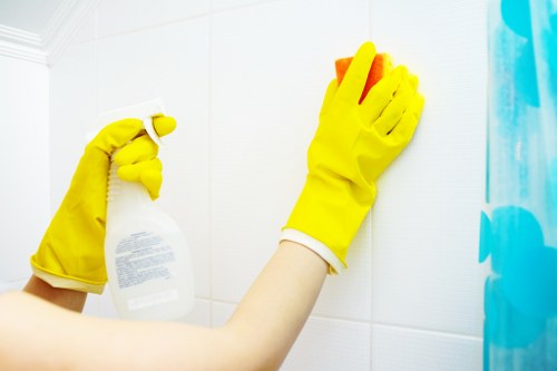 Cleaning operative reviewing service details before starting work