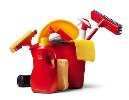 Household cleaning supplies arranged for oven cleaning